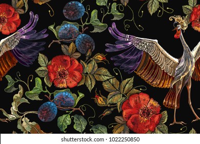 Embroidery crane birds, vine grapes and roses seamless pattern. Template for clothes, textiles, t-shirt design. Classical embroidery two Japanese cranes grapes and red buds of roses art pattern 