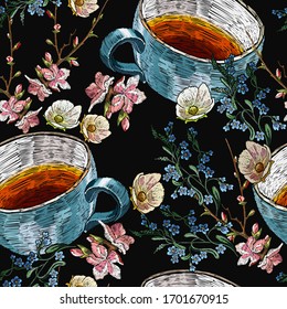 Embroidery cup of tea, pink flowers of apricot, meadow herbs and lemon slices, seamless pattern. Spring template of clothes, tapestry, t-shirt design. Fashion garden art 