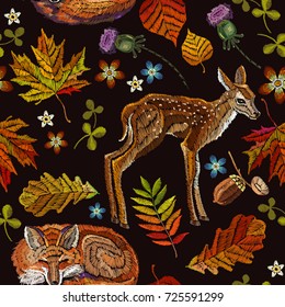 Embroidery deer and fox, autumn seamless pattern. Classical september embroidery autumn leaves, fawn deer, sleeping fox, oak and maple leaves. Fashionable template for design of clothes 