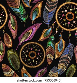 Embroidery dream catcher boho seamless pattern. Native american indian talisman dream catcher. Fashionable template design clothes. Magic tribal feathers pattern, t-shirt design. Clothes ethnic style 