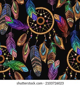 Embroidery dream catcher and feathersseamless pattern. Native american indian talisman. Magic tribal  background, t-shirt design. Template for clothes ethnic style 