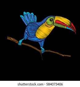 Embroidery. Embroidered design element - bird - toucan -in vintage style on a black background. Stock vector illustration.