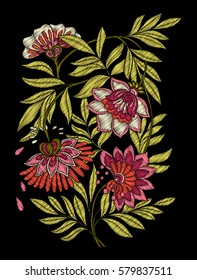 Embroidery. Embroidered design elements with flowers and leaves in vintage style on a black background. Stock vector illustration.