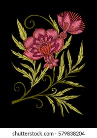 Embroidery. Embroidered design elements with flowers and leaves in vintage style on a black background. Stock vector illustration.