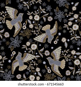 Embroidery ethnic seamless pattern with pigeons and flowers. Vector embroidered floral design with birds for fashion.