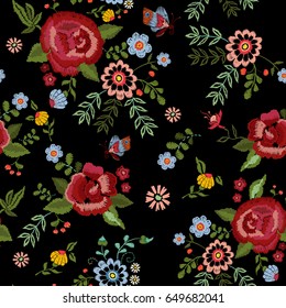 Embroidery ethnic seamless pattern with roses and fantasy flowers. Vector embroidered traditional floral design for fashion fabric