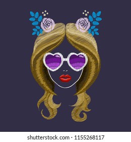 Embroidery. Face of a beautiful girl. Heart glasses. Red lips. Pink rose with leaves.
