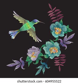 Embroidery fashion pattern with hummingbird and exotic flowers. Vector traditional folk floral ornament with bird on black background for clothing design.