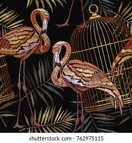 Embroidery flamingo , palm tree and birds cage tropical seamless pattern. Fashionable template for design of clothes. Embroidery pink flamingos, tropical summer fashion background 