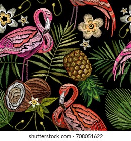 Embroidery flamingo , palm tree leaves, pineapple, coconut tropical seamless pattern. Fashionable embroidery pink flamingos, tropical summer background.  Fashionable template for design of clothes 