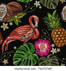 Embroidery flamingo, palm tree leaves, pineapple, coconut tropical seamless pattern. Fashionable template for design of clothes. Tropical embroidery pink flamingos, summer background 