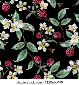 Embroidery floral pattern with aspberries and bee. Vector embroidered patch with flowers for wearing design.