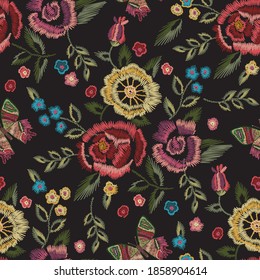 Embroidery floral seamless pattern with simplified roses and forget me not flowers. Vector traditional easy ornament on black background for fashion design.
