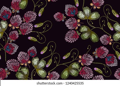 Embroidery flowers clover seamless pattern. Fashionable template for design of clothes 