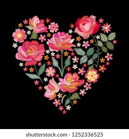 Embroidery flowers and leaves. Beautiful bouquet in shape of heart. Colorful floral composition on black background.