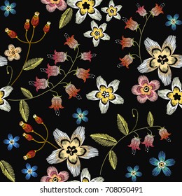 Embroidery flowers seamless pattern. Beautiful chamomiles, cornflowers, classical embroidery seamless background. Fashionable template for design of clothes 