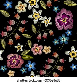 Embroidery flowers seamless pattern. Fashionable template for design of clothes. Beautiful camomiles, cornflowers, classical embroidery seamless background 