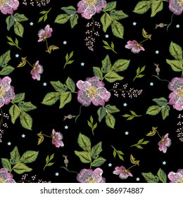 Embroidery folk seamless pattern with dog roses and forget me not flowers. Vector traditional floral ornament on black background for design