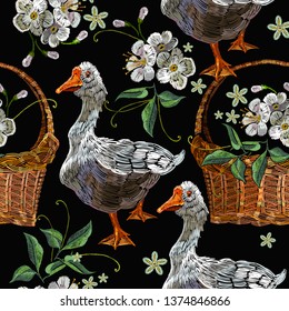 Embroidery goose, wicker baskets  and white flowers of cherry seamless pattern. Farm animals art. Template for clothes, textiles and t-shirt design
