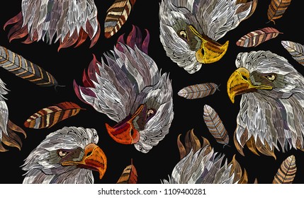 Embroidery head eagle and feather seamless pattern Template for clothes, textiles, t-shirt design. Classical embroidery hawk head