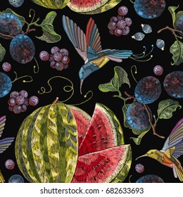 Embroidery hummingbirds, plum, grapes watermelon seamless pattern. Beautiful classical embroidery tropical birds  humming bird fruit watermelons and  blossoming plum summer seamless pattern 