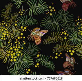 Embroidery mimosa flowers and butterflies seamless pattern. Fashion template for clothes, textiles, t-shirt design. Classical embroidery vintage yellow mimosa brunch and tropical butterflies