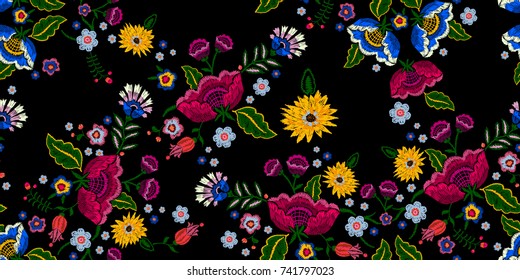 Embroidery native seamless pattern with simplify flowers. Vector embroidered traditional floral design for fashion wearing.