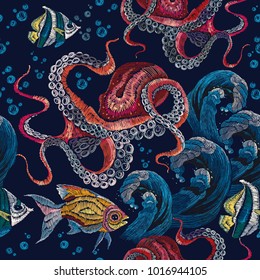 Embroidery octopus, sea wave and tropical fishes seamless pattern. Fashionable clothes, t-shirt design. Classical embroidery red octopus underwater, wave, fishes, seamless fashion pattern 