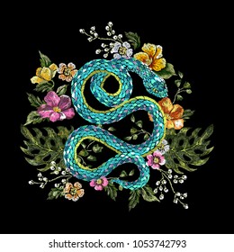 Embroidery oriental floral pattern with snake and flowers. Vector seamless embroidered template with flowers and animal for fashion design.