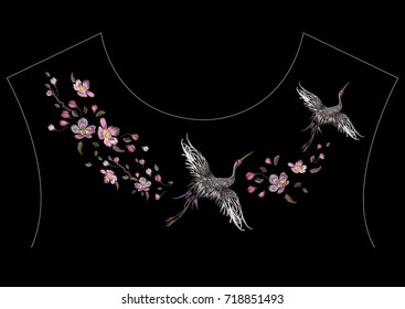 Embroidery oriental neckline pattern with cranes and cherry blossom. Vector embroidered floral patch with bird for clothing design.