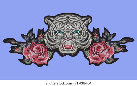 Embroidery oriental patch with tiger head and roses. Vector embroidered floral sticker with flowers for fashion design