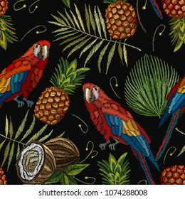 Embroidery parrot, palm tree leaves, pineapple, coconut tropical seamless pattern. Template for design of clothes. Fashionable embroidery tropical summer background 