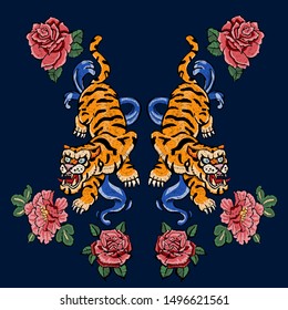 Embroidery patch with oriental tigers and flowers. Vector embroidered floral motif.