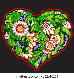 Embroidery with patterned love heart on black background