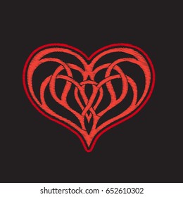 Embroidery with patterned love heart on black background