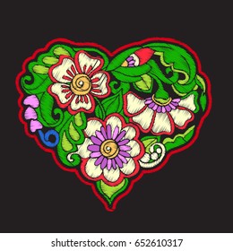 Embroidery with patterned love heart on black background