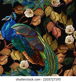 Embroidery peacocks and autumn leaves seamless pattern. Tails of tropical birds art. Fashionable template for design of clothes 