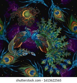 Embroidery peacocks, magic moon and fethers, seamless pattern. Fairy tale style. Fashionable template for design of clothes. Tropical forest art  