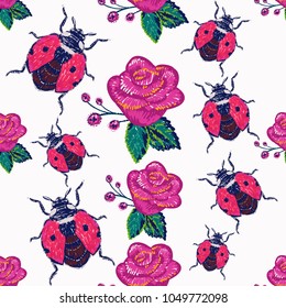 Embroidery pink rose and flying ladybag, insect patch. Fashion patches with summer wild nature illustration embroideries. Seamless pattern backdrop. Traditional art with insects on white background.