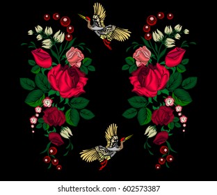 Embroidery pink roses, flowers and crane birds for decoration. Vector fashion embroidered ornament on a black background for textile, fabric traditional folk decoration