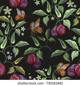 Embroidery plums and butterfly floral seamless pattern. Classical embroidery ripe plums and tropical butterfly seamless pattern hand drawn fashion template for clothes