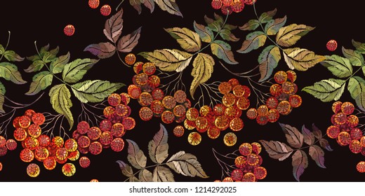 Embroidery red branches of a mountain ash berry seamless pattern. Fashionable template for design of clothes. Classical embroidery red berries art style 