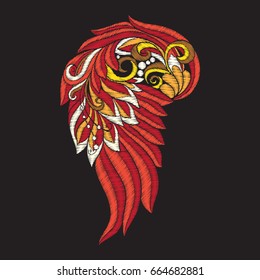 Embroidery with red decorative ethnic patterned wing on black