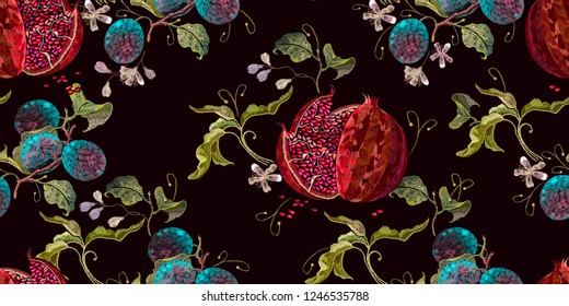 Embroidery ripened red pomegranate and flowers of cherry and plum seamless pattern. Template clothes, t-shirt design, textile design 