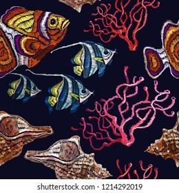 Embroidery sea life, sea shells and corals, tropical fishes seamless pattern. Classical embroidery underwater art pattern. Fashionable clothes 