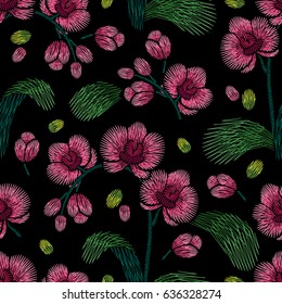 Embroidery seamless floral pattern with orchid on black background. Vector fashion ornament