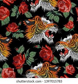 Embroidery seamless floral pattern with tiger and red roses. Vector seamless embroidered template for fashion design.