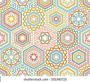 Embroidery seamless hexagons pattern. Vector high detailed stitches. Colourful ethnic textile boundless background. 