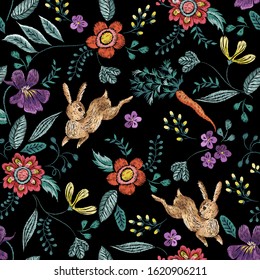Embroidery seamless neckline pattern with flowers, rabbits, carrots and flowers . Vector embroidered new year floral wreath for design.