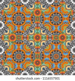 Embroidery seamless pattern with abstract diagonal tiles. Ornament in gray, yellow and blue colors. Embroidery for fashion textile and fabric.